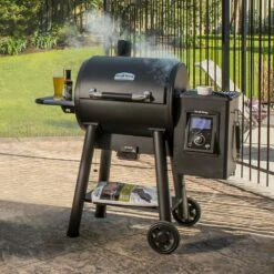 BBQDIRECT Shop -BBQDIRECT Shop Broil King Regal Pellet 400 Wi Fi and Bluetooth Controlled 26 Inch Pellet Grill 495051 Lifestyle 2