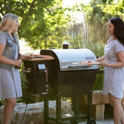 Camp Chef Woodwind 24 Wi-Fi & Bluetooth Controlled 24-Inch Pellet Grill 17 Camp Chef Woodwind 24 Wi-Fi & Bluetooth Controlled 24-Inch Pellet Grill -BBQDIRECT Shop Camp Chef Woodwind 24 Wi Fi and Bluetooth Pellet Grill PG24CL Lifestyle Side View