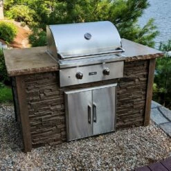 Coyote Ready-To-Assemble 5 Ft. Outdoor Kitchen Island For Natural Gas Grill And Access Door - Brown Stacked Stone -BBQDIRECT Shop Coyote Ready To Assemble 5 Ft Outdoor Kitchen Island Brown Stacked Stone RTAC G5 SB Lifestyle