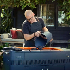 Everdure By Heston HUB 54-Inch Freestanding Charcoal Grill With Rotisserie 15 Everdure By Heston HUB 54-Inch Freestanding Charcoal Grill With Rotisserie -BBQDIRECT Shop Everdure by Heston HUB 54 Inch Freestanding Charcoal Grill with Rotisserie and Electronic Ignition HBCE2BUS Lifestyle Adding Charcoal