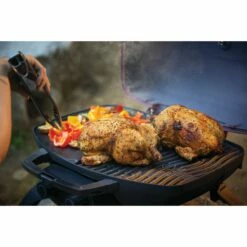 Napoleon TravelQ 285 Portable Propane Gas Grill With Griddle - Red -BBQDIRECT Shop Low Res JPG TQ285 Lifestyle Camping Chicken with tongs