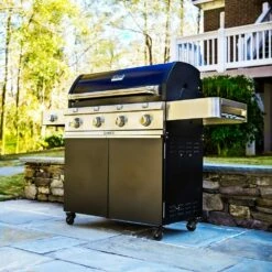 Saber Grills Cast Black 670 40-Inch 4-Burner Freestanding Infrared Propane Gas Grill With Single Ring Side Burner -BBQDIRECT Shop Saber Grills Cast Black 670 4 Burner Freestanding Gas Grill R67CC1117 Lifestyle