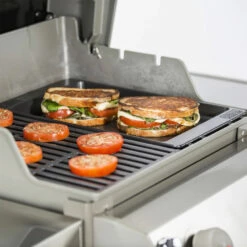 Weber Grills Porcelain-Enameled Cast-Iron Griddle For Spirit II 200/300 & Spirit 200/300 Series Grills -BBQDIRECT Shop Weber 7658 griddle spiritII placed in grill cooking paninis