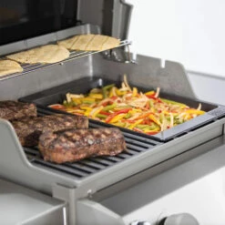 Weber Grills Porcelain-Enameled Cast-Iron Griddle For Spirit II 200/300 & Spirit 200/300 Series Grills -BBQDIRECT Shop Weber 7658 griddle spiritII placed in grill cooking vegetables