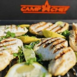 Camp Chef 24-Inch Reversible Cast Iron Grill & Griddle 15 Camp Chef 24-Inch Reversible Cast Iron Grill & Griddle -BBQDIRECT Shop ex90lw cgg24b beach chicken close up with lemons 2